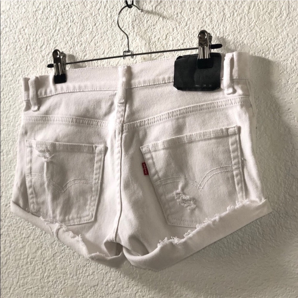 Levi’s • White cut off distressed Jean shorts